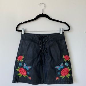Black leather lace up miniskirt with embroidery